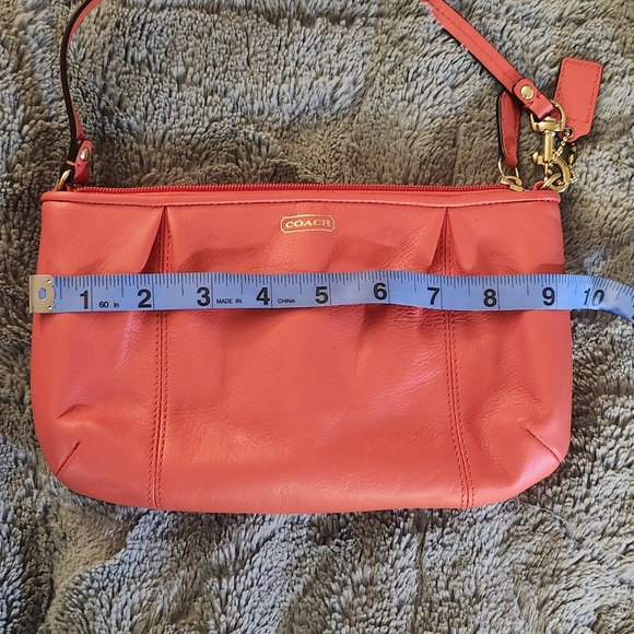 Like new Coach Large wristlet in redish or coral color - Picture 8 of 8